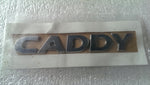 Emblemat napis tył VW CADDY 2K5853687 NOWY ORYGINA